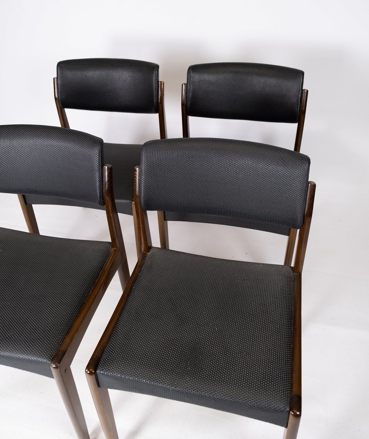 Set Of Four Dining Chairs Of Black Upholstery And Dark Wood Of Danish Design From The 1960s. photo furniture