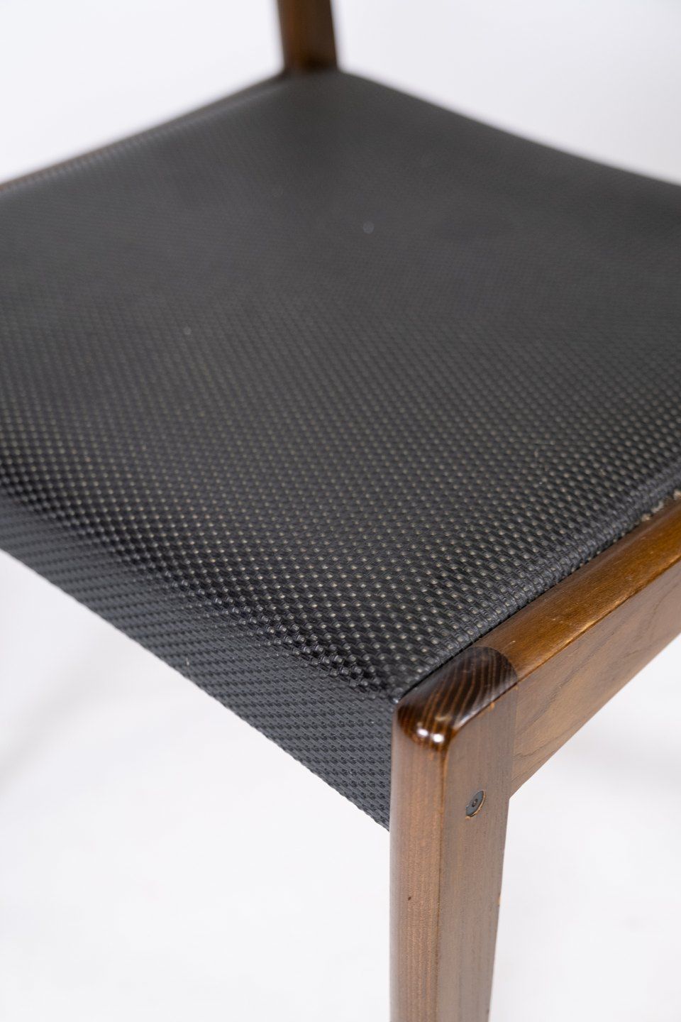Set Of Four Dining Chairs Of Black Upholstery And Dark Wood Of Danish Design From The 1960s. photo vinterior