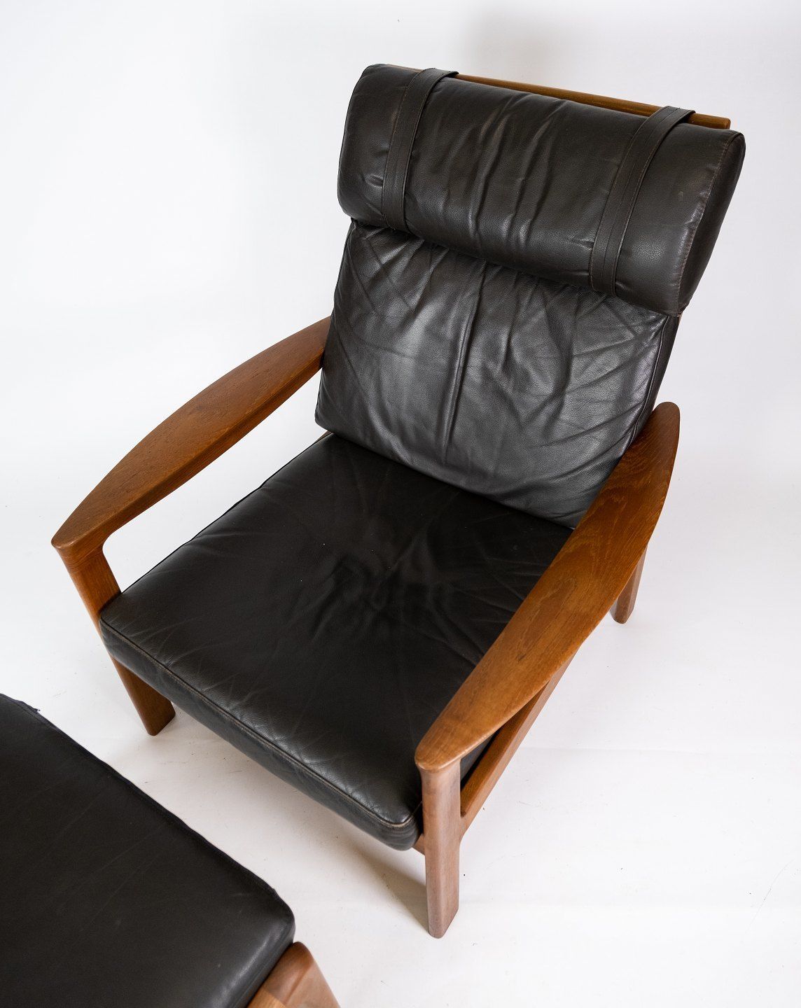 Armchair And Stool In Teak Upholstered With Black Leather Designed By Arne Vodder And Manufactured By Komfort In The 1960s. photo furniture