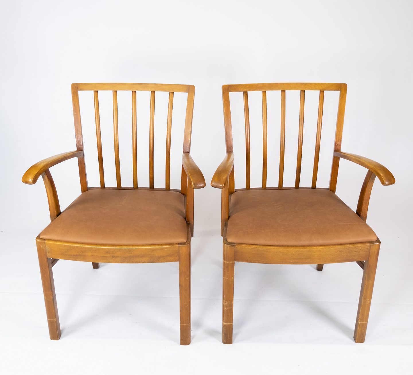 Set Of Two Armchairs In Light Wood And Upholstered With Light Brown Leather By A Danish Master Carpenter From The 1940s.