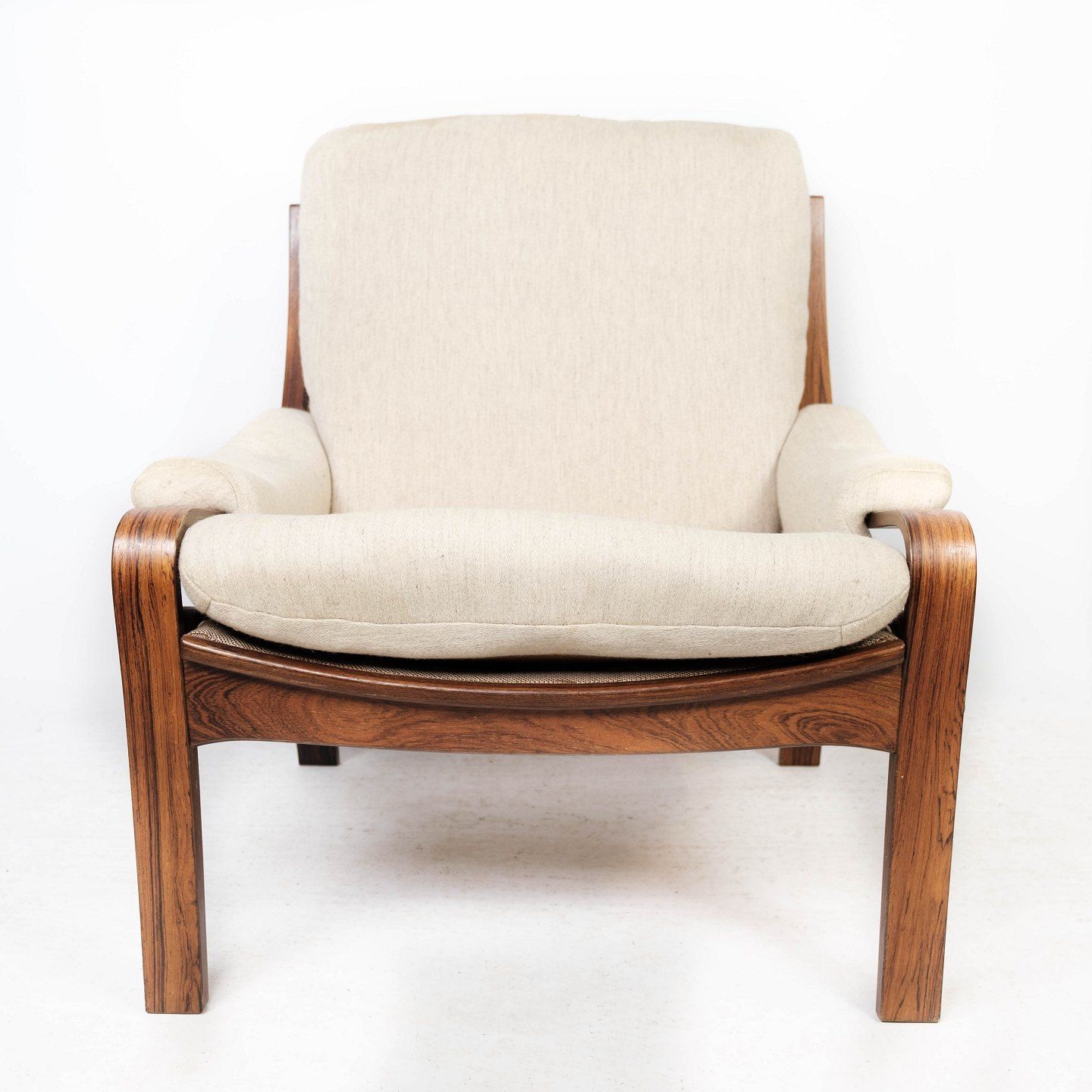 Easy Chair In Rosewood And Upholstered With Light Fabric, Of Danish Design From The 1960s. photo furniture