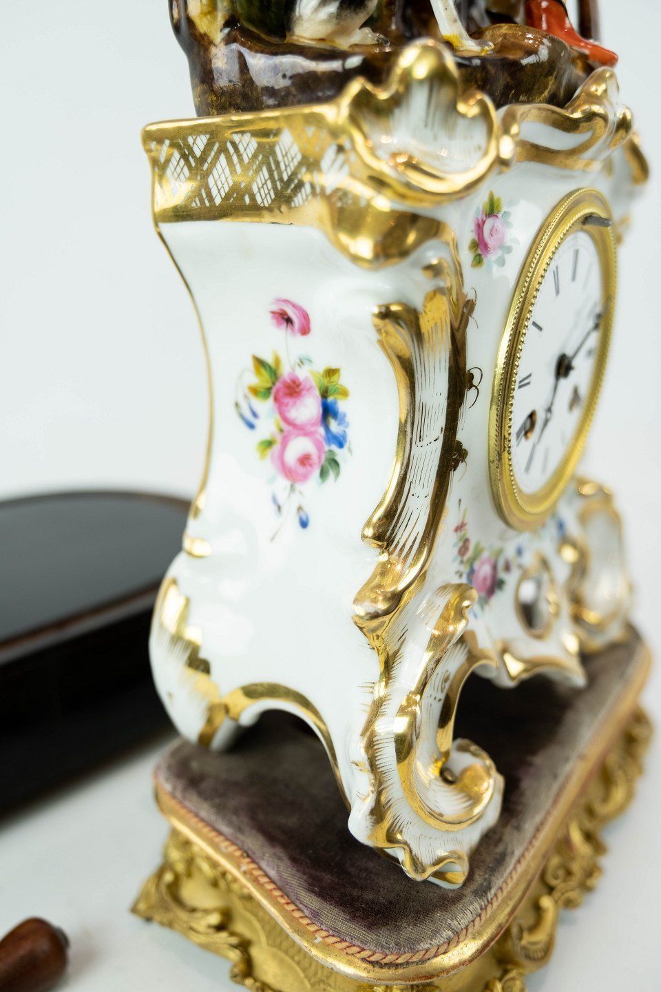 French Table Clock With Glass Dome And Decorated With Porcelain Figurine From 1860. photo Home Decor