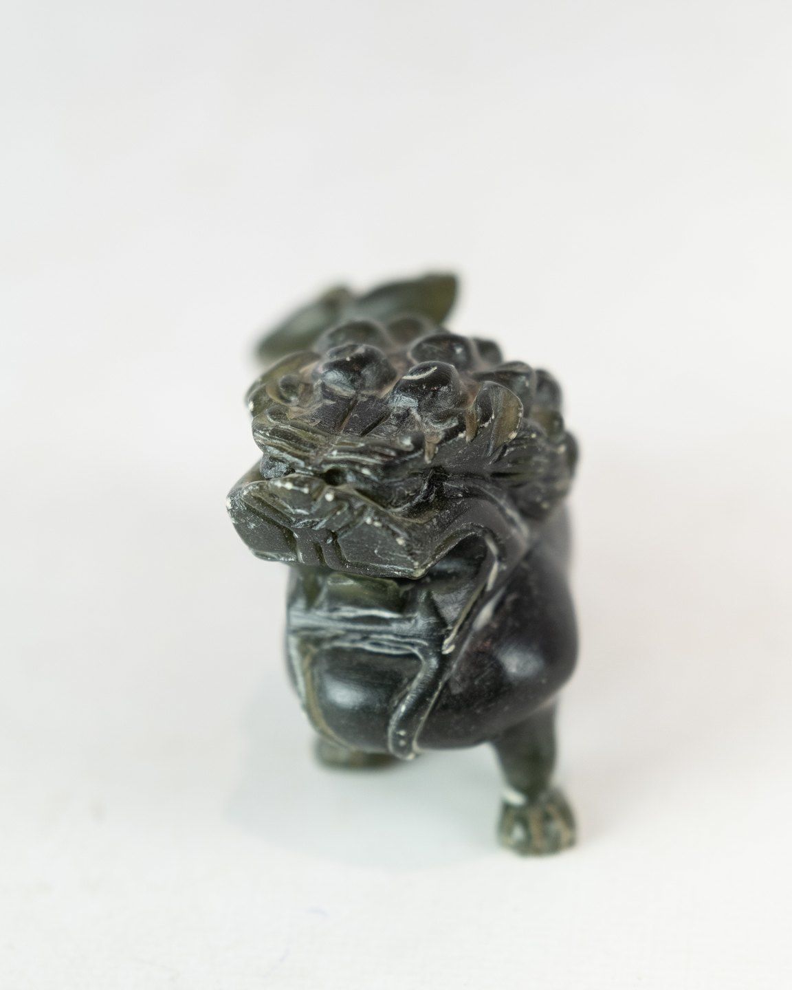 A Pair Of Soapstone Figures In The Shape Of Lions photo furniture