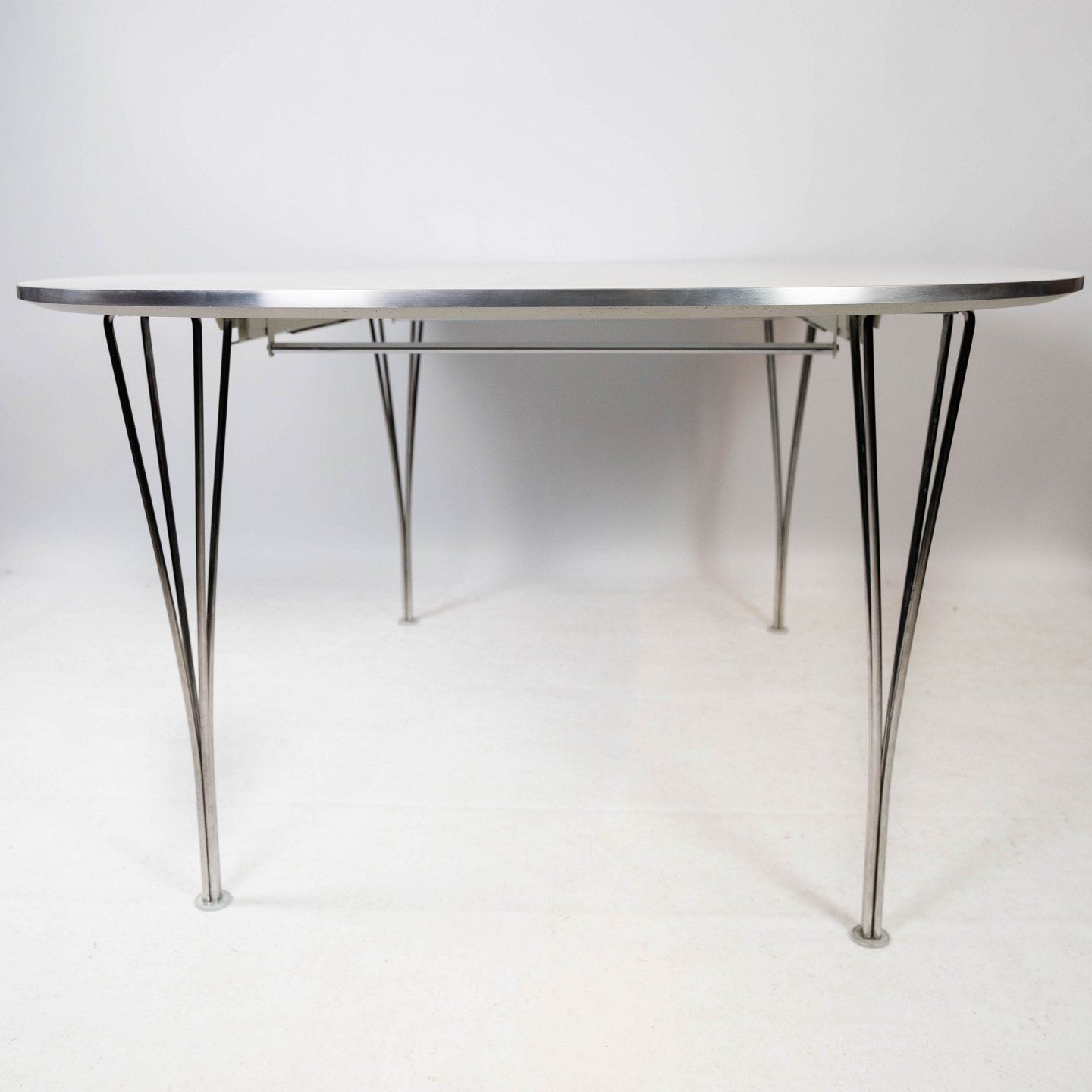Super Ellipse Dining Table With White Laminate Designed By Piet Hein And Arne Jacobsen, And Manufactured By Fritz Hansen In 1998. photo Furniture