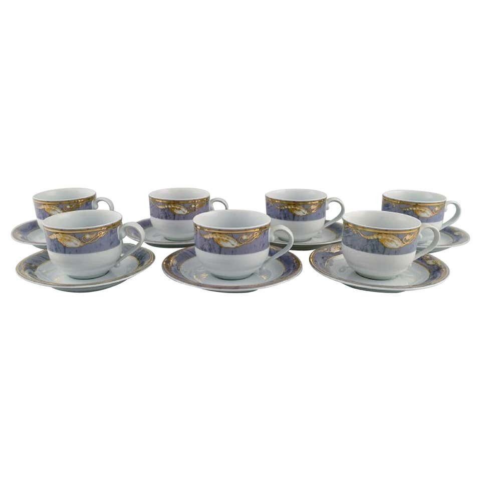 Seven Royal Copenhagen Gray Magnolia Coffee Cups With Saucers In Porcelain