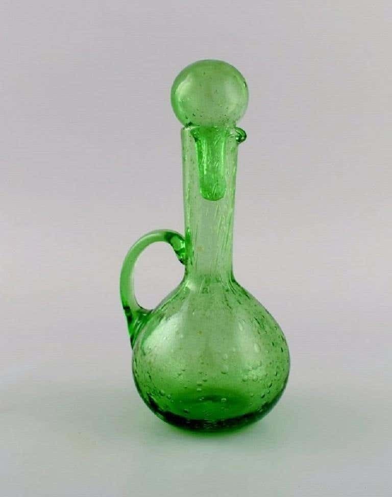 Biot, France, Two Decanters, Six Glasses And Two Small Jugs In Green Art Glass photo for sale