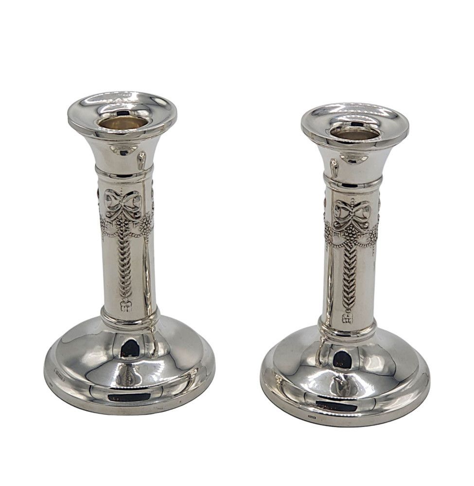 A Lovely Pair Of 20th Century Sterling Silver Candlesticks After Adams