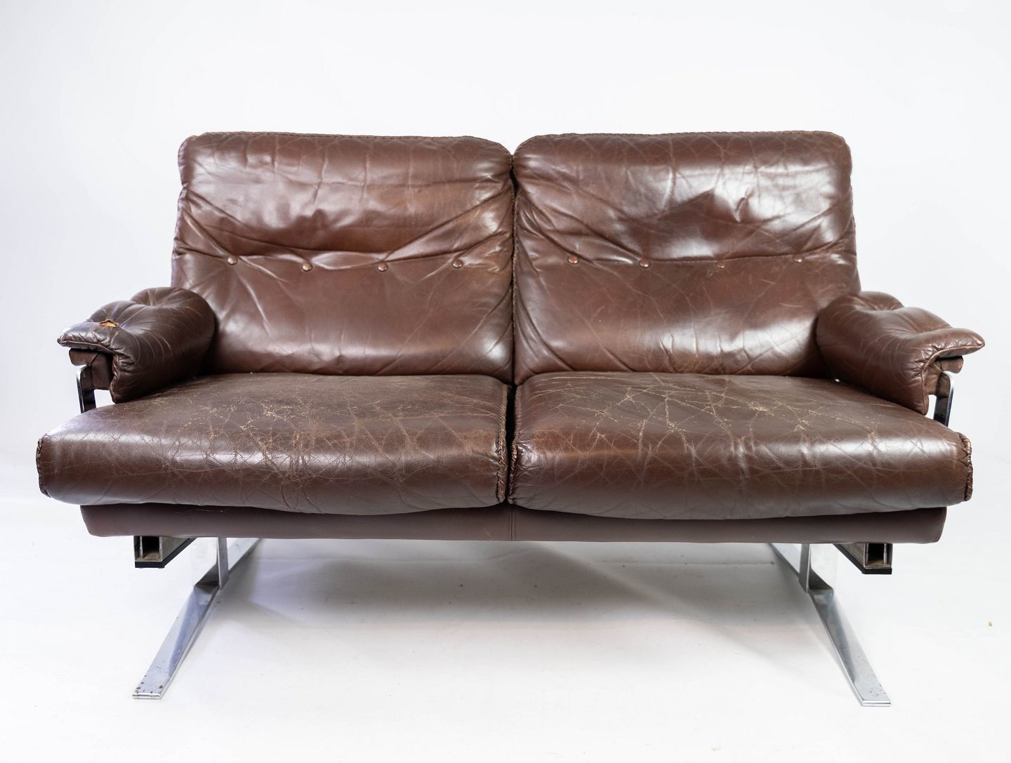 Two Seater Sofa In Brown Patinated Leather And Metal Frame, Designed By Arne Norell From The 1970s.