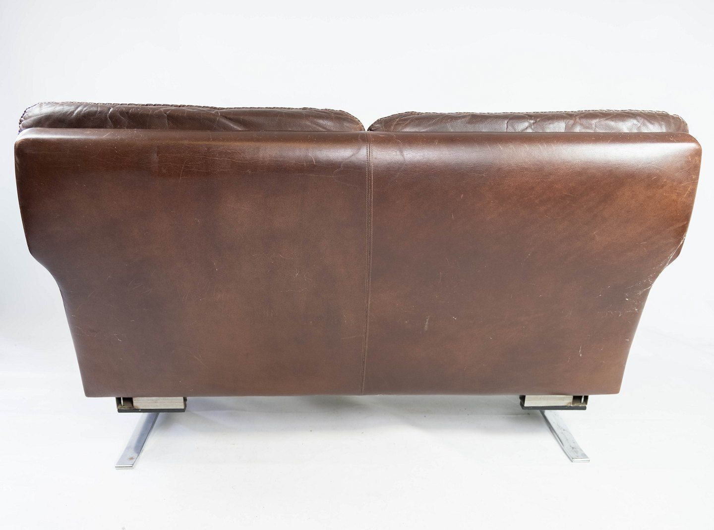 Two Seater Sofa In Brown Patinated Leather And Metal Frame, Designed By Arne Norell From The 1970s. photo for sale