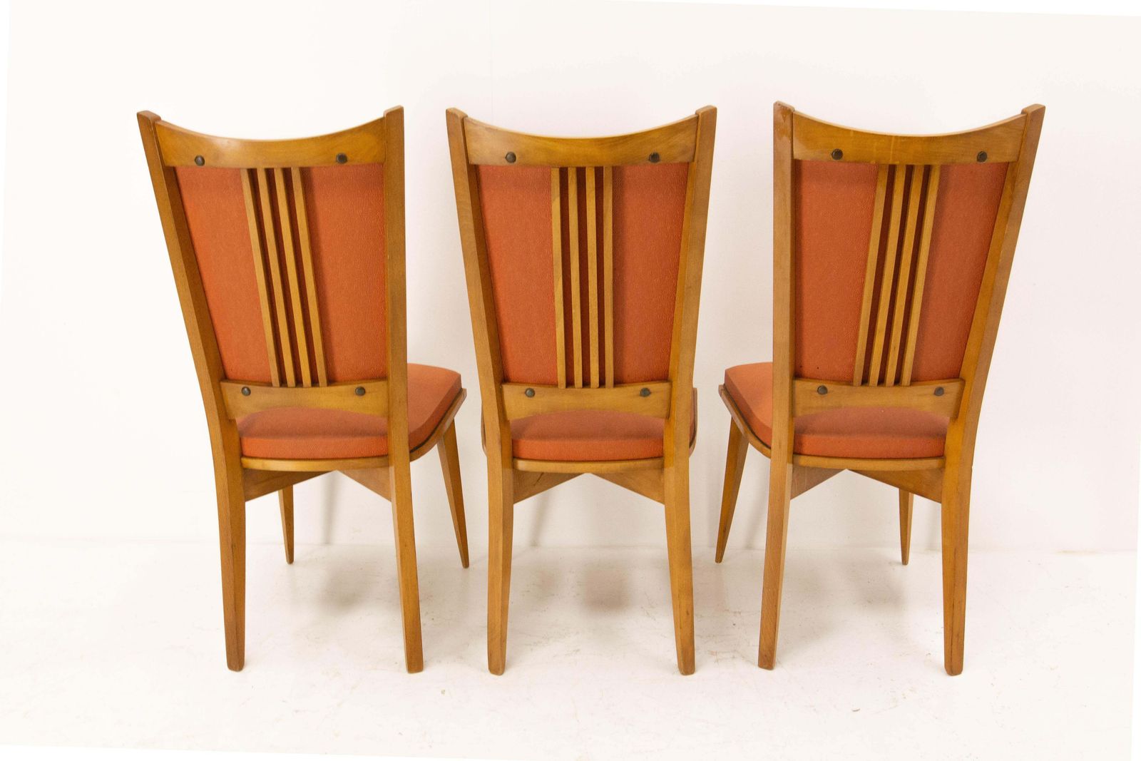 photo for sale Six chaises de salle à manger mid-century françaises en hêtre et moleskine rouge, vers 1950