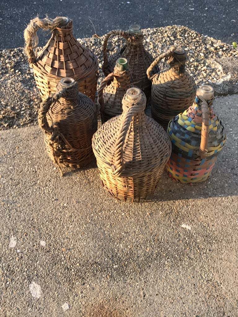 Set Of Seven Midcentury Vintner Woven Baskets With Demijohn Wine Bottles photo furniture