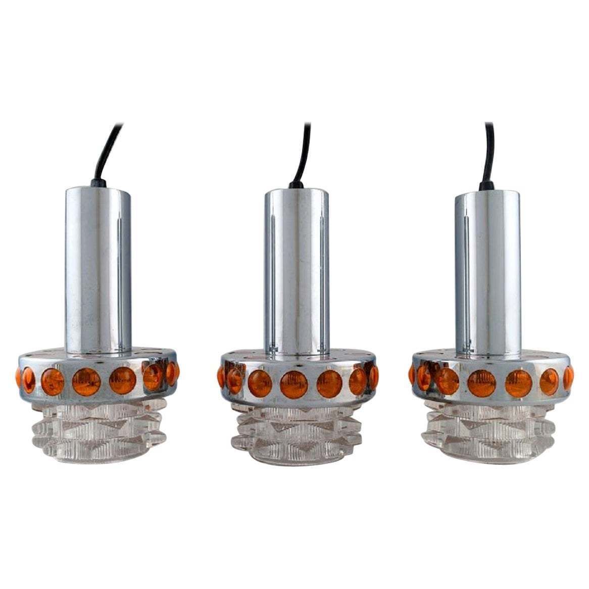 Raak  Holland  Three Ceiling Pendants In Chromed Metal And Art Glass  1970s