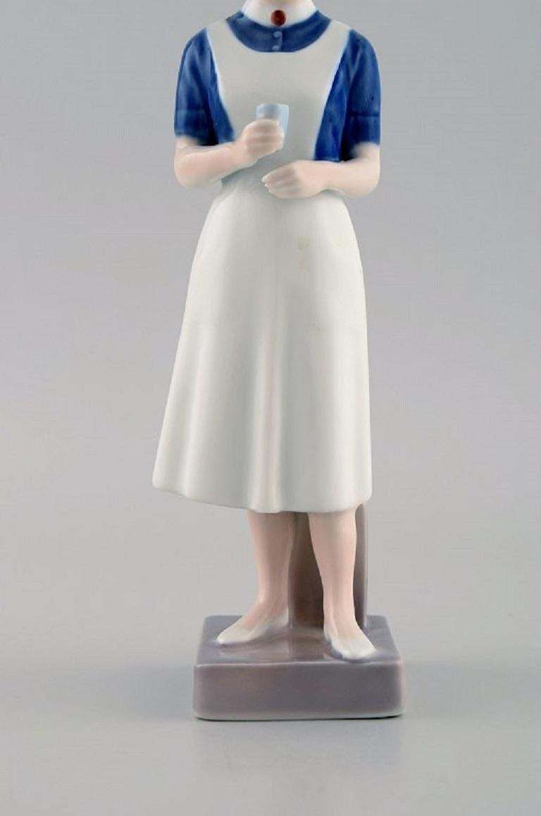 Royal Copenhagen Porcelain Figurine, Nurse, Dated 1969 1974 photo for sale