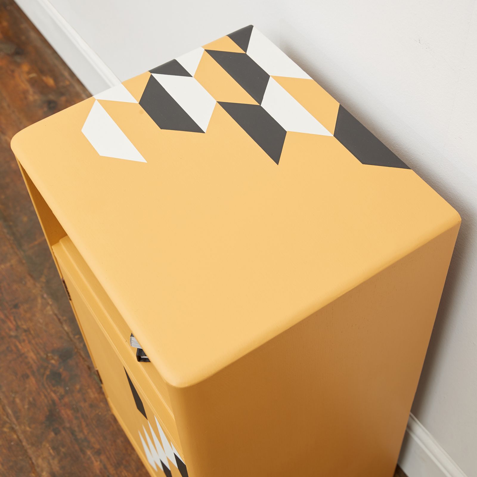 Mustard Yellow Wooden Bedside Table With Hand Painted Geometric Design In Black And White photo vinterior