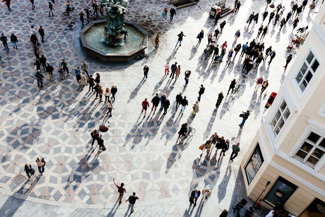 "High Angle View Of Crowd Of People On The City Square During Sunset" By Alexander Spatari