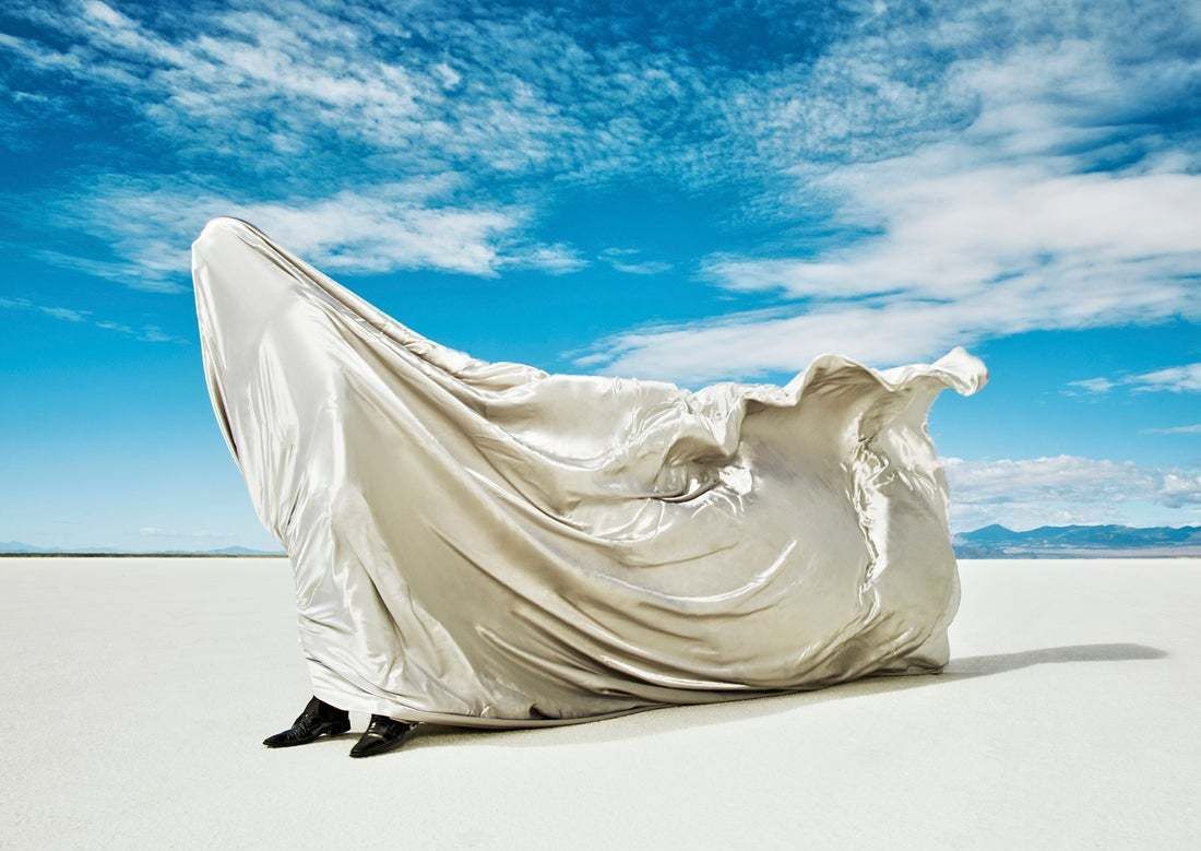 "Man Covered In Fabric Being Blown By Wind" By Andy Ryan