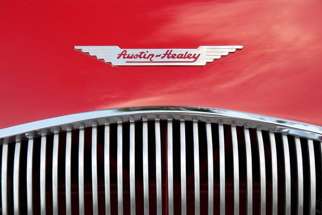 "Red 1956 Austin Healey Grille And Insignia" By Constantgardener