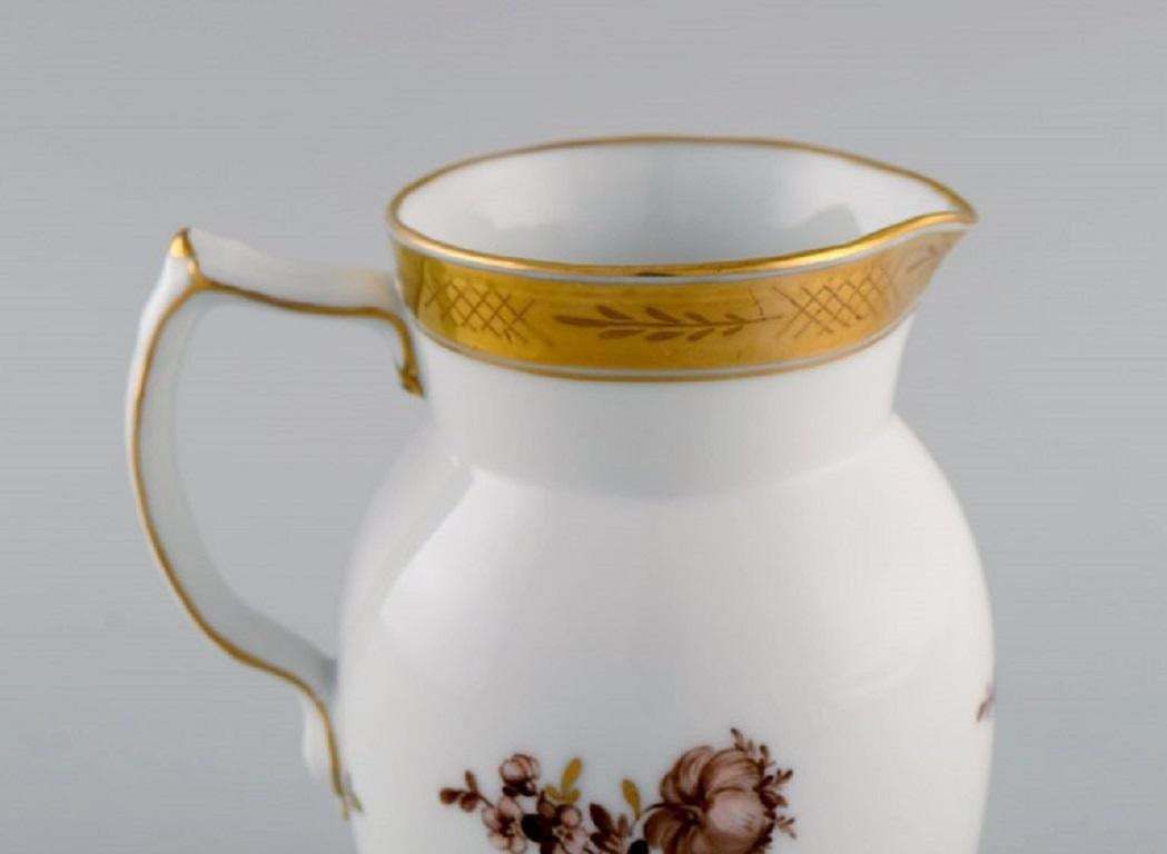 Royal Copenhagen Golden Basket Jug In Porcelain With Flowers And Gold Decoration photo for sale