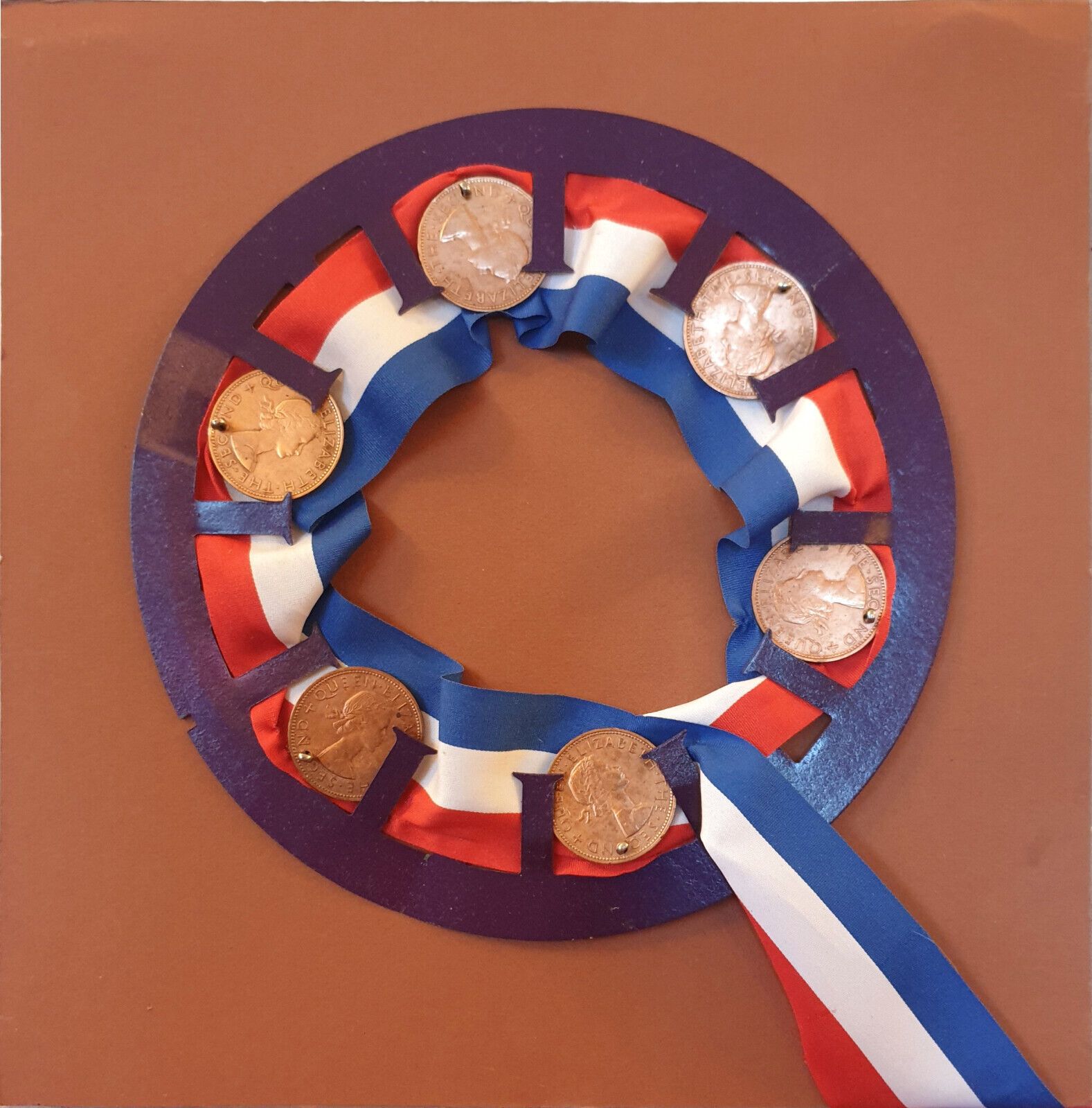 Assemblage Art By Edward Mackenzie. New Zealand Pennies In A Rosette photo furniture