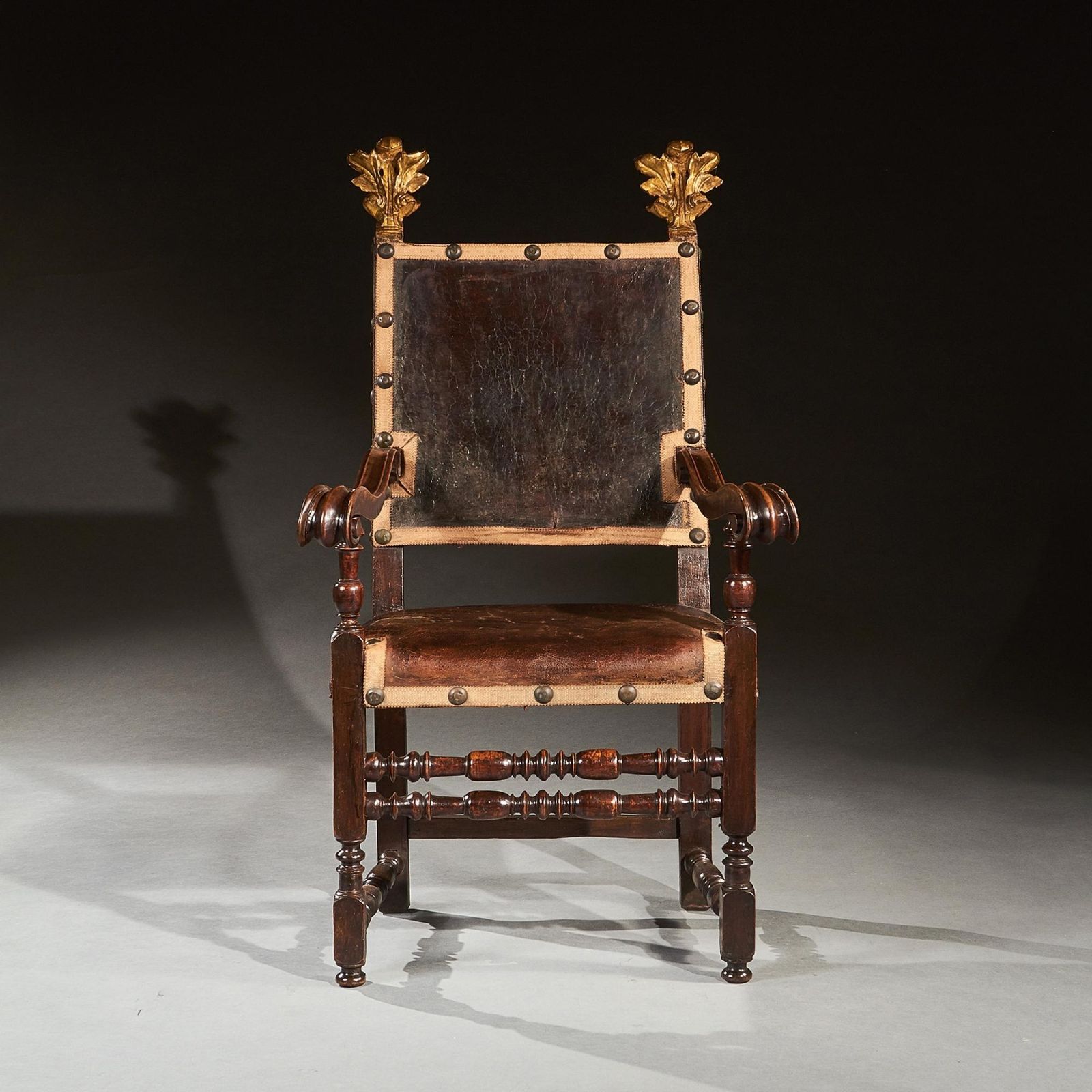 Pair Of 17th Century Italian Baroque Parcel Gilt Walnut Leather Armchairs photo for sale