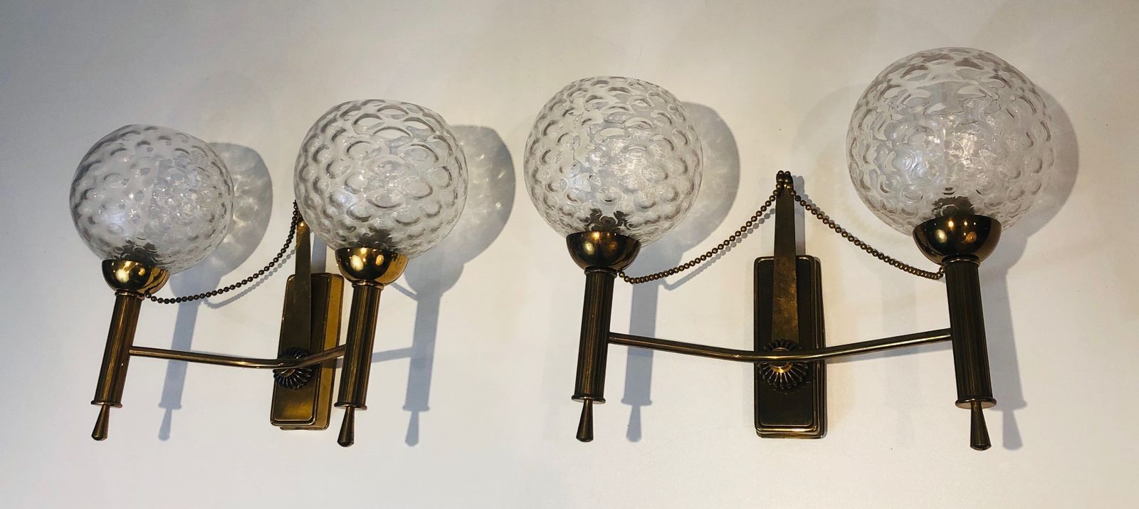 photo furniture Pair Of Brass And Glass Ball Sconces. Around 1970