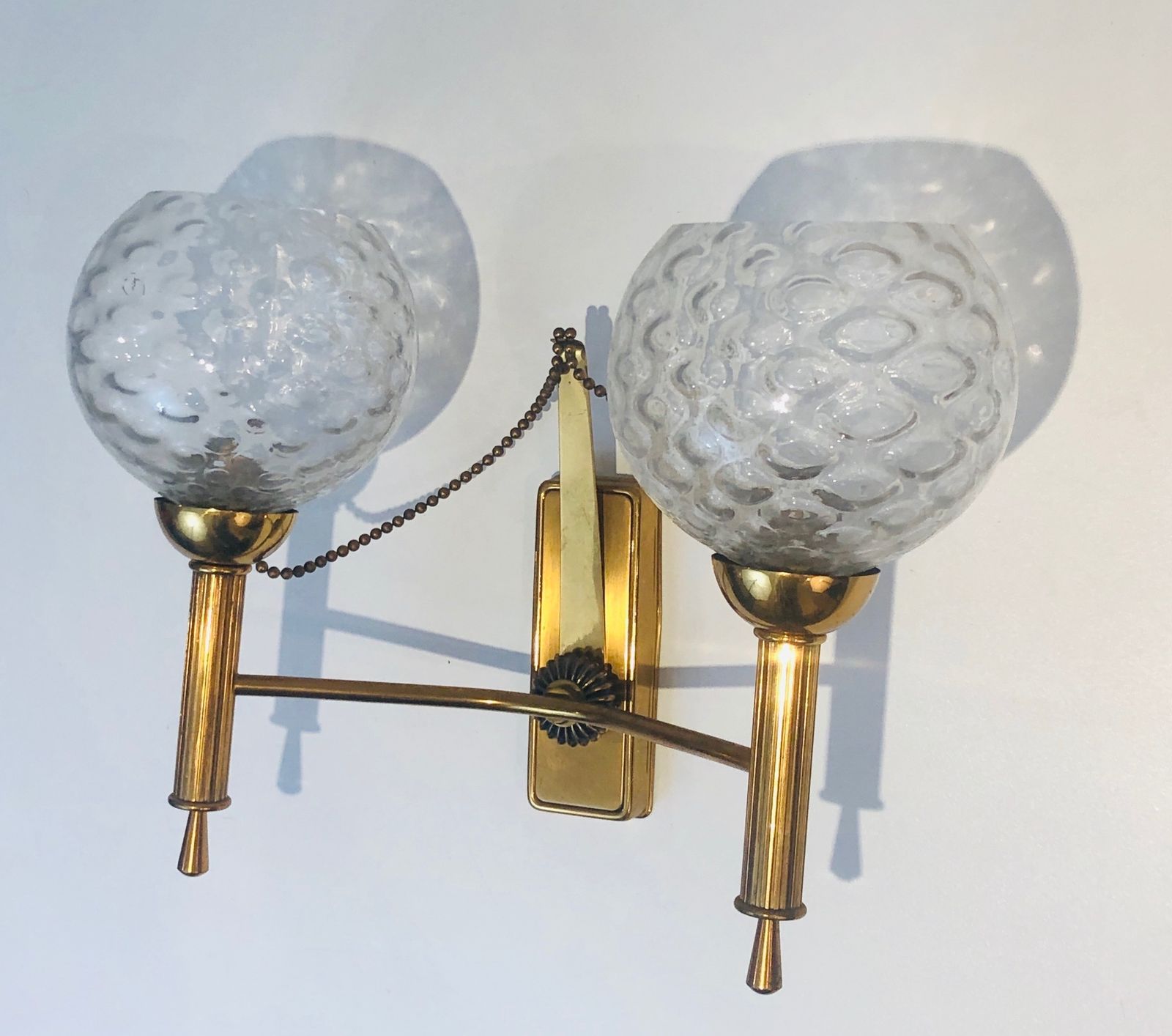 photo vinterior Pair Of Brass And Glass Ball Sconces. Around 1970