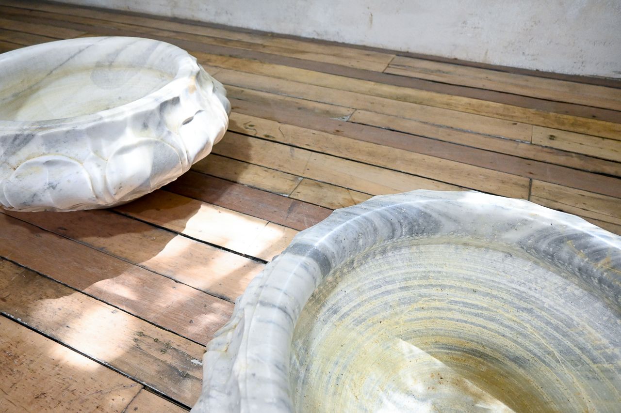 photo furniture A Pair Of Carved Lotus Form Marble Jardiniere Planters
