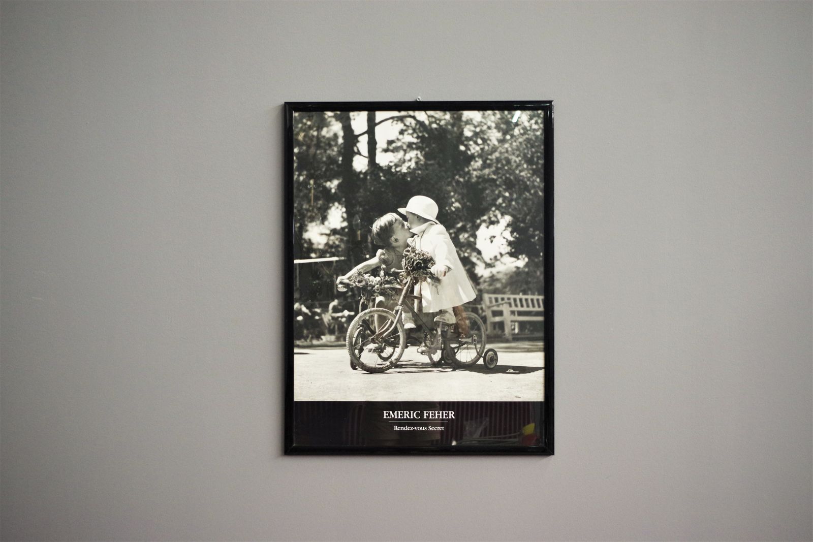 Black And White Print. Children Kissing On The Tricycle, 2000 photo for sale