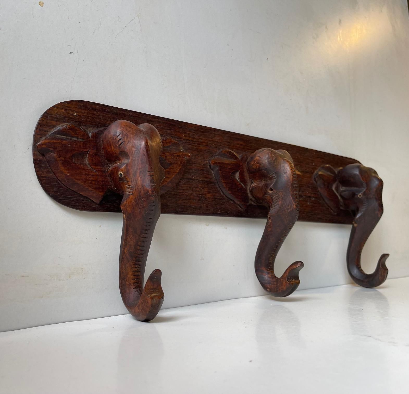 Hand Carved Elephant Coat Or Towel Rack In Dark Wood, 1930s photo for sale