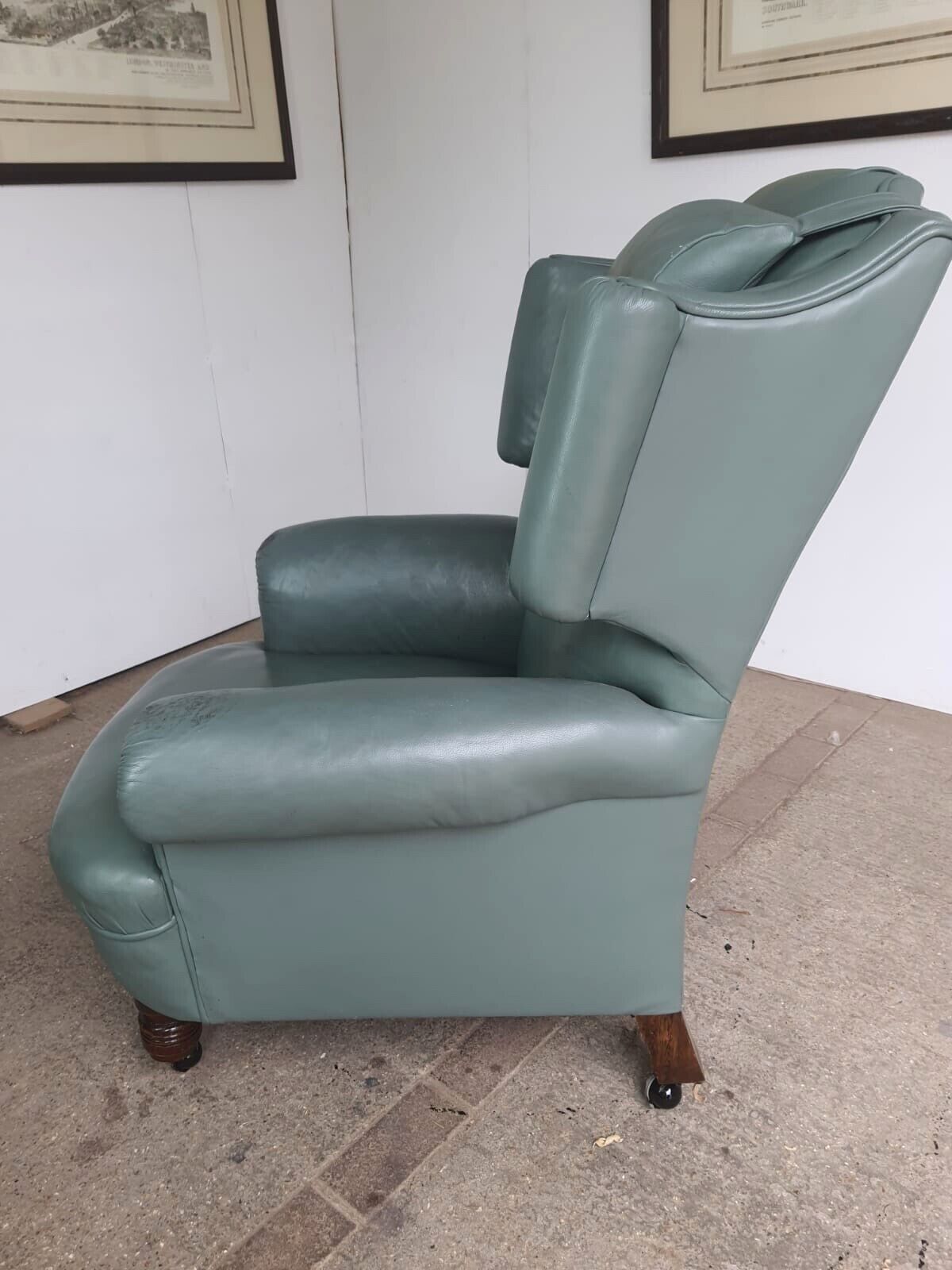 photo furniture Antique Wing Back Green Leather Armchair Wood Legs Castors