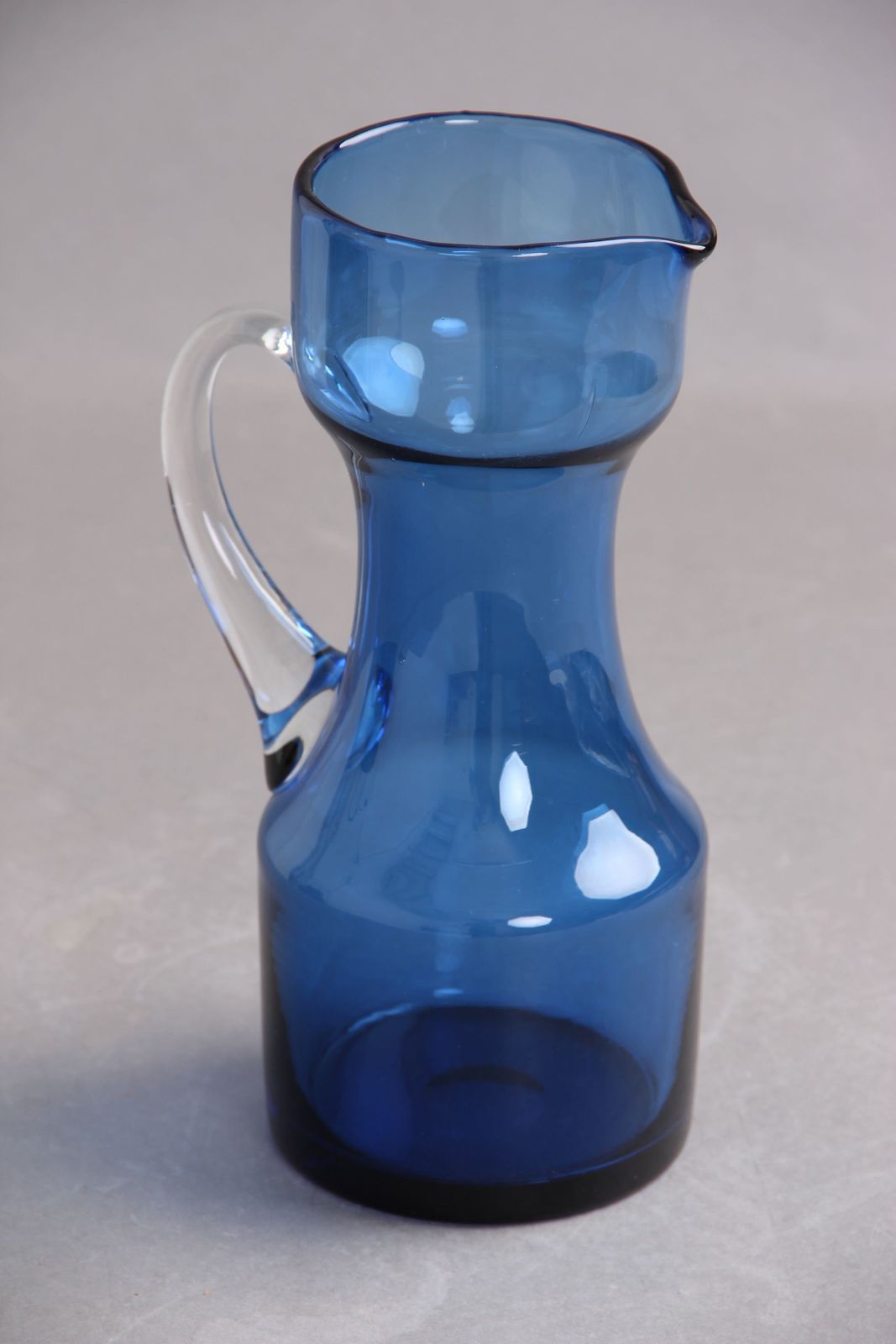 Glass Jug In Blue Glass With Attached Handle In Transparent Glass, Typical 1950s 1960s Design In High Quality. photo 115.0