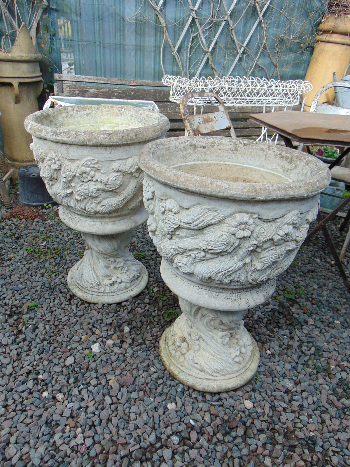 Pair Large Weathered Reconstituted Stone Urns Decorated With Flowers photo for sale