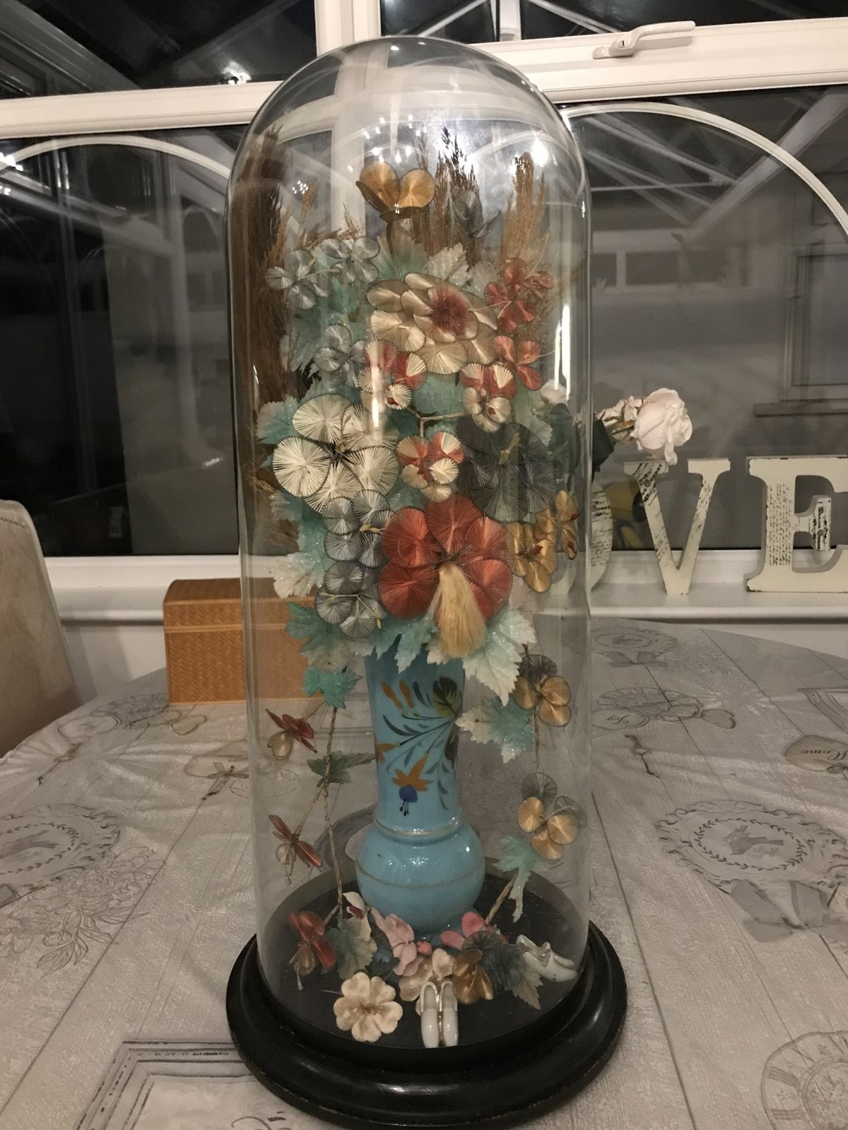 Tall Victorian Glass Dome Containing A Vase Of Silk Flowers . photo for sale