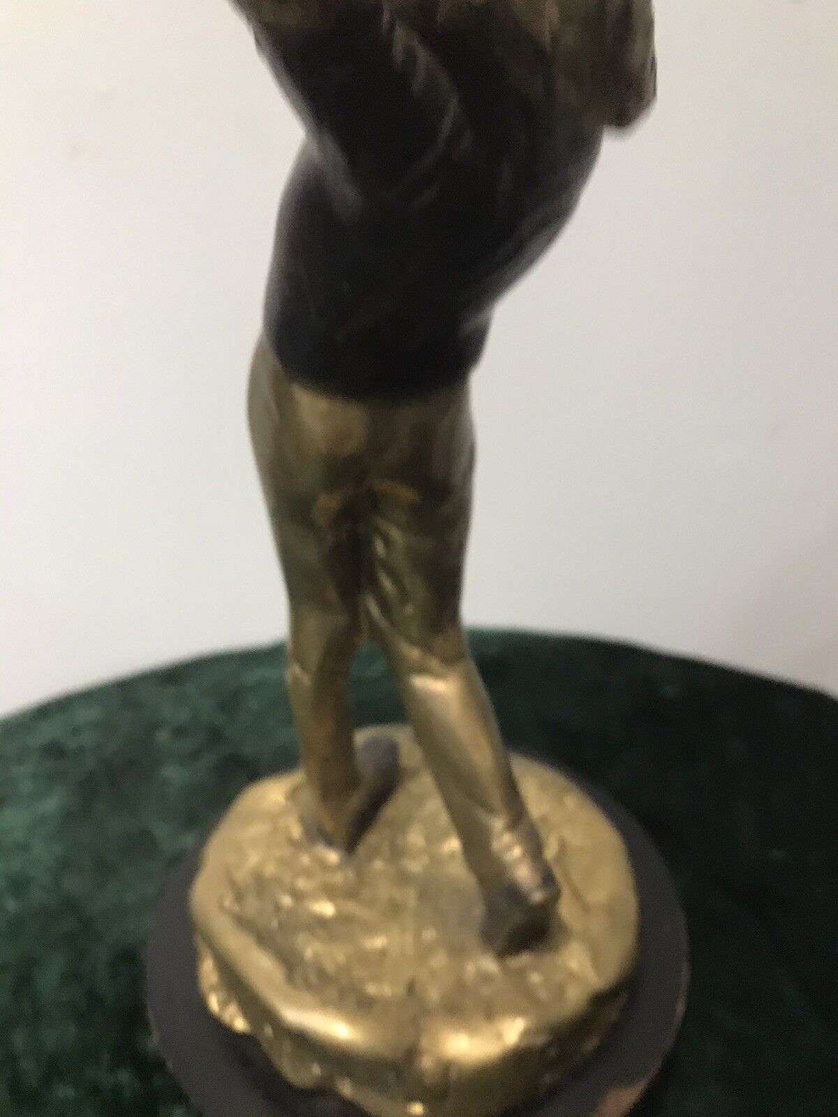 Bronze Statue Of A Golfer On Wooden Plinth photo vinterior
