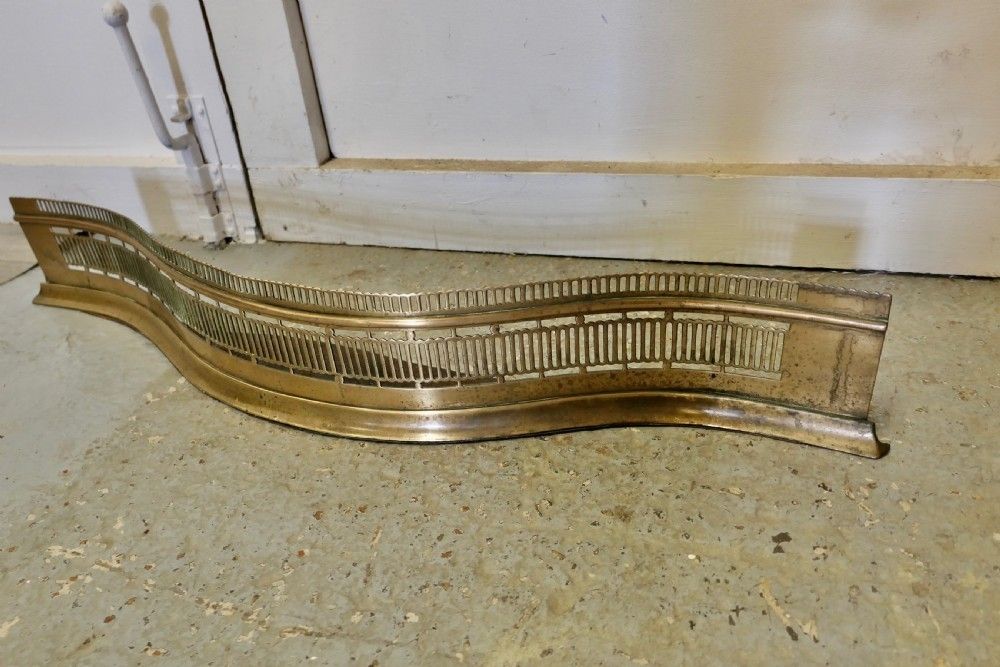 Victorian Pierced Serpentine Shaped Brass Fender photo for sale