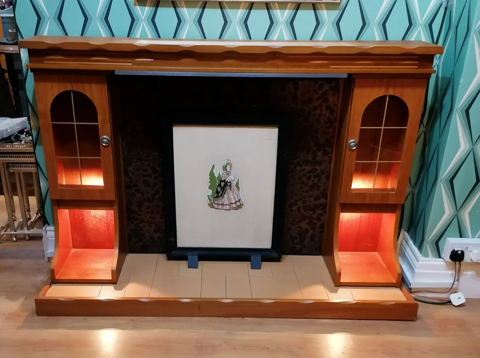 Fire Surround Display Unit Illumination In Storage Shelf Space