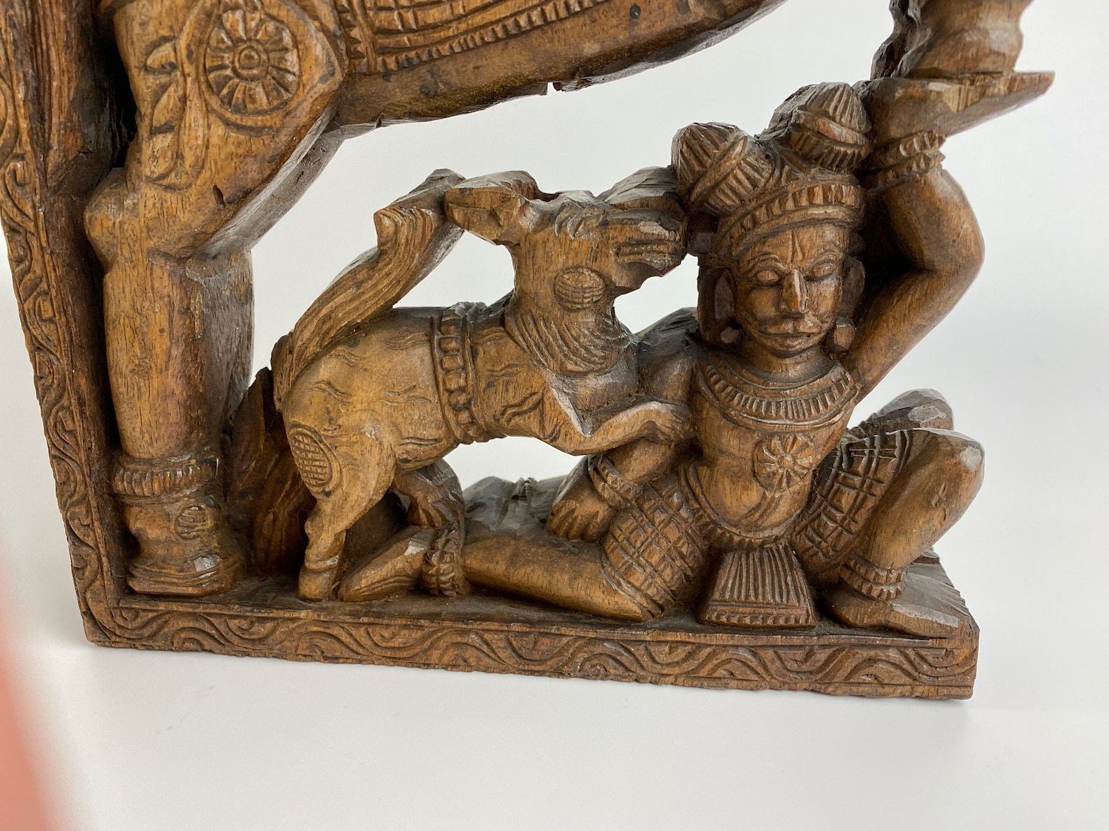 Handmade Carving Panel Of Wood From Indian Temple Car To Celebrate Hindu Gods Man On Horse And Man With Dog photo for sale