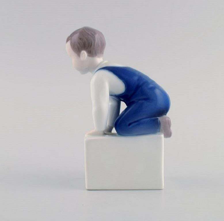 Claire Weiss For Bing & Grøndahl. Porcelain Figure. Boy. 1970s photo furniture