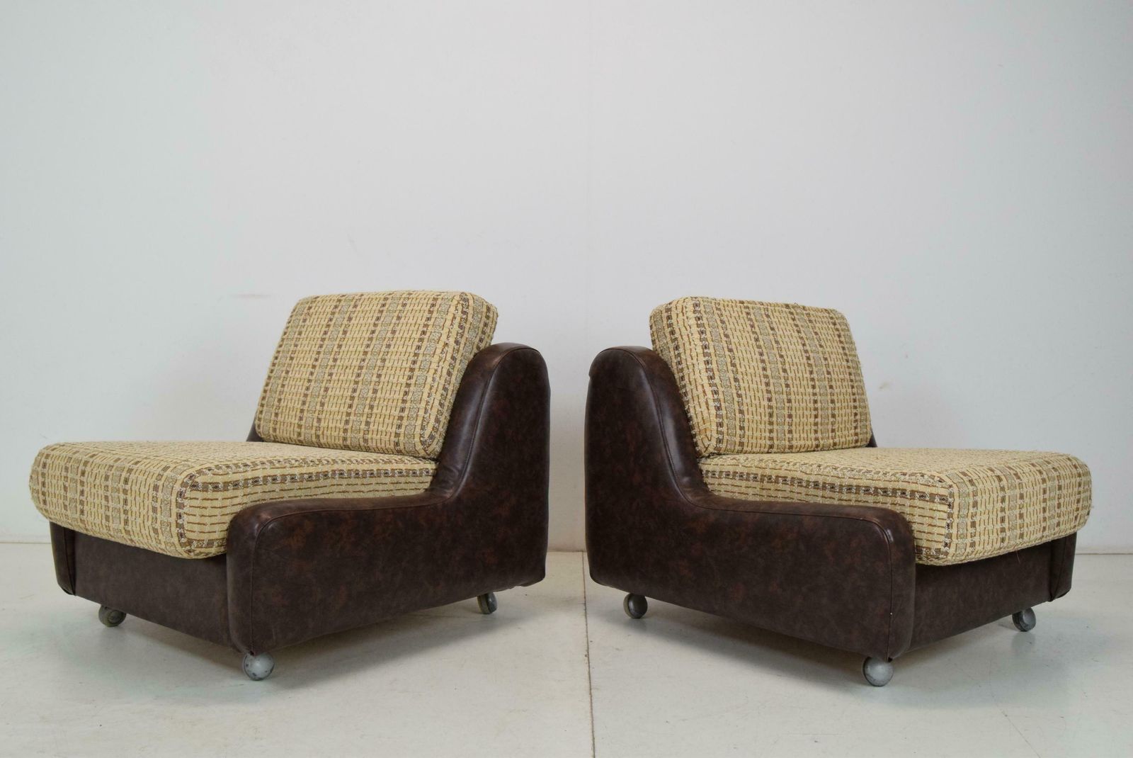 Pair Of Mid Century Leatherette Armchairs On The Wheels,1970's. photo for sale