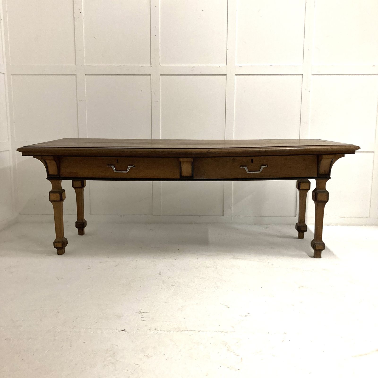 An Unusual Style, 19th Century French Walnut Serving Table, Four Tapered And Block Legs With Ebonised Decoration. Two Large Drawers With Later Handles