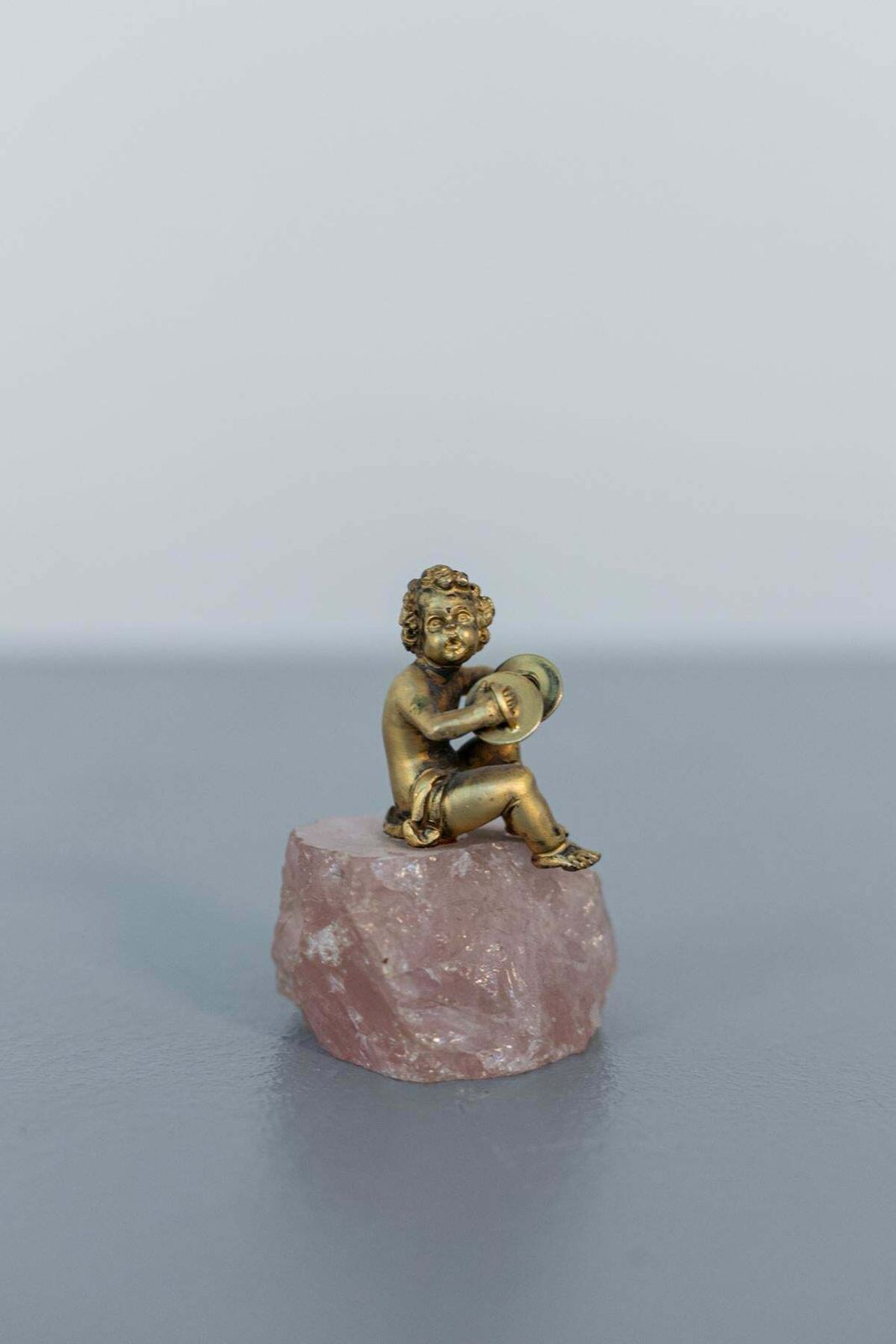 Baroque Statue Of Silver Cherub On Rose Quartz photo for sale