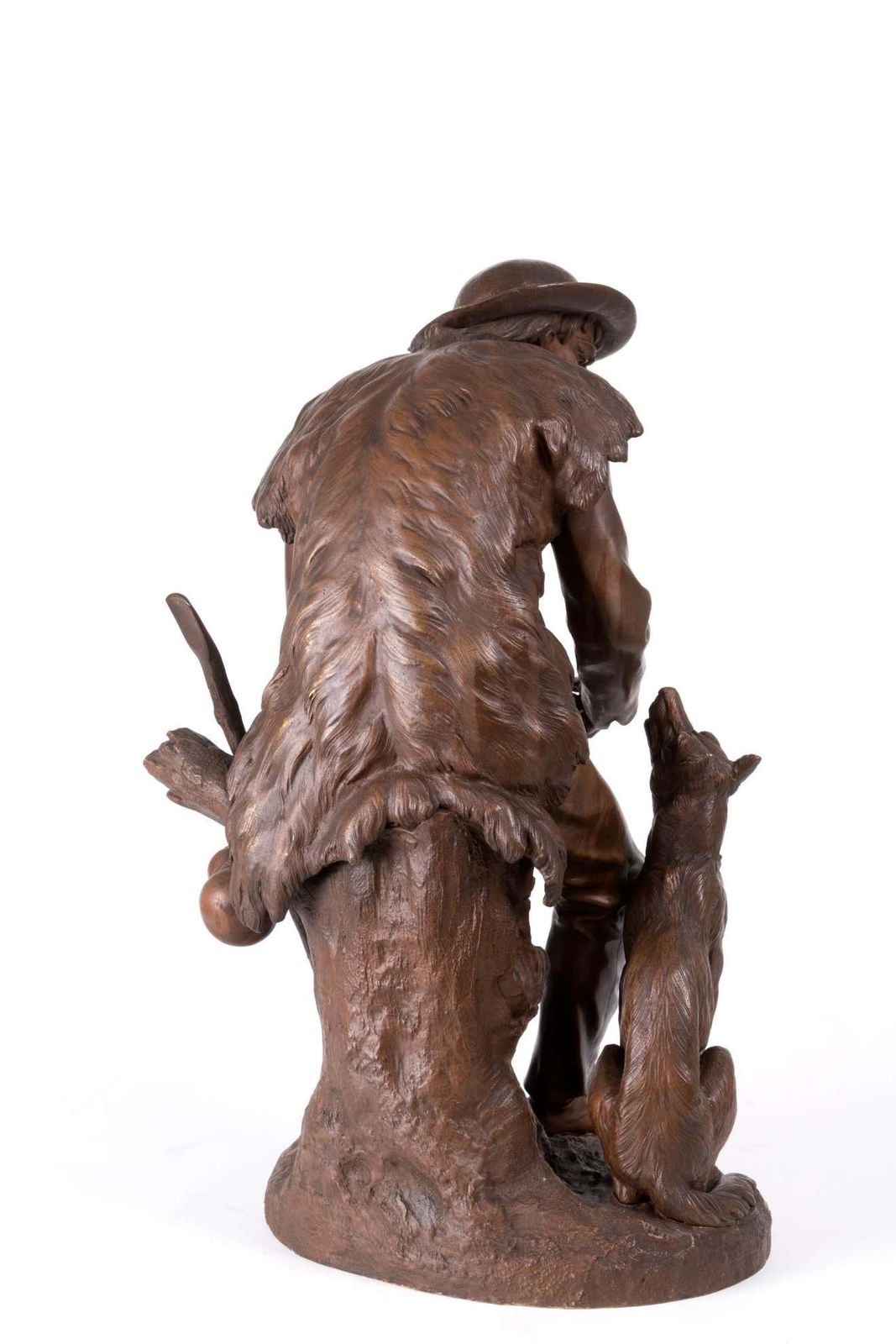 Anatole J. Guillot Bronze Sculpture Depicting "Seated Woodcarver With Dog photo for sale
