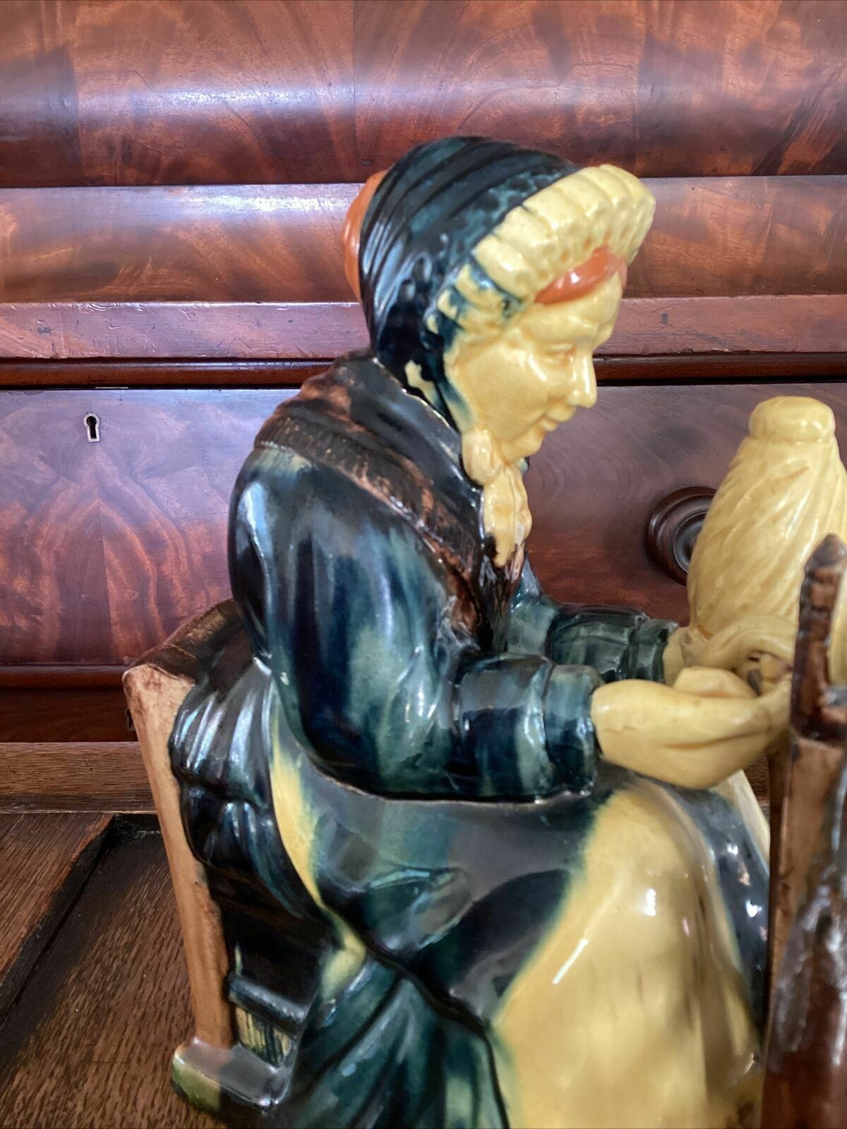 85.0 Early 20th C Continental Bisque Pottery Figurine. Dutch Woman Spinning Yarn photo