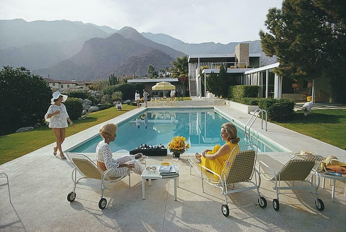 Catch Up By The Pool By Slim Aarons