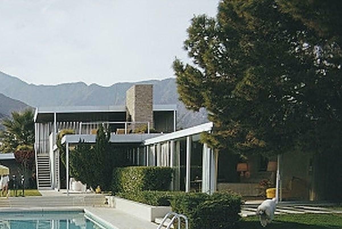 Catch Up By The Pool By Slim Aarons photo for sale
