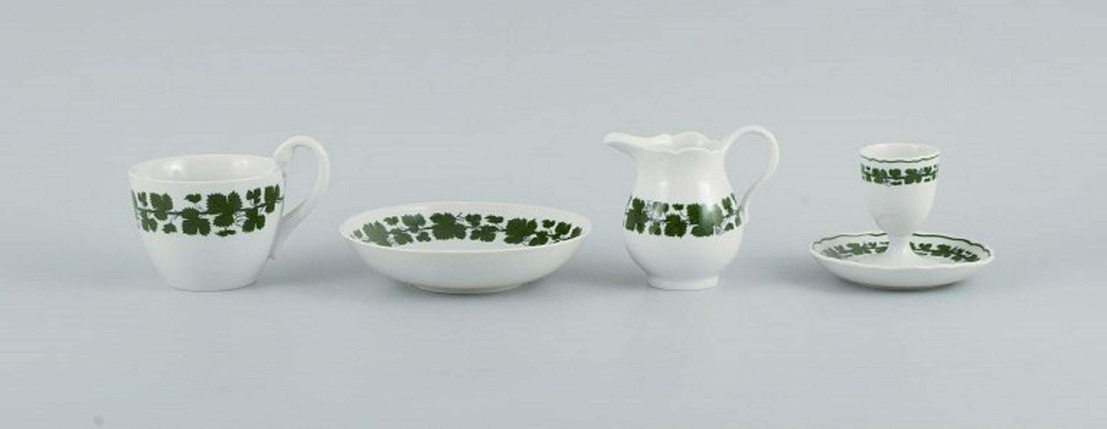 Meissen. Green Ivy Vine. Four Parts: Egg Cup, Cup, Saucer And Cream Jug