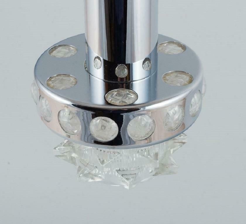 Raak, The Netherlands. Designer Lamp In Chrome, Plastic And Clear Glass. photo Lighting