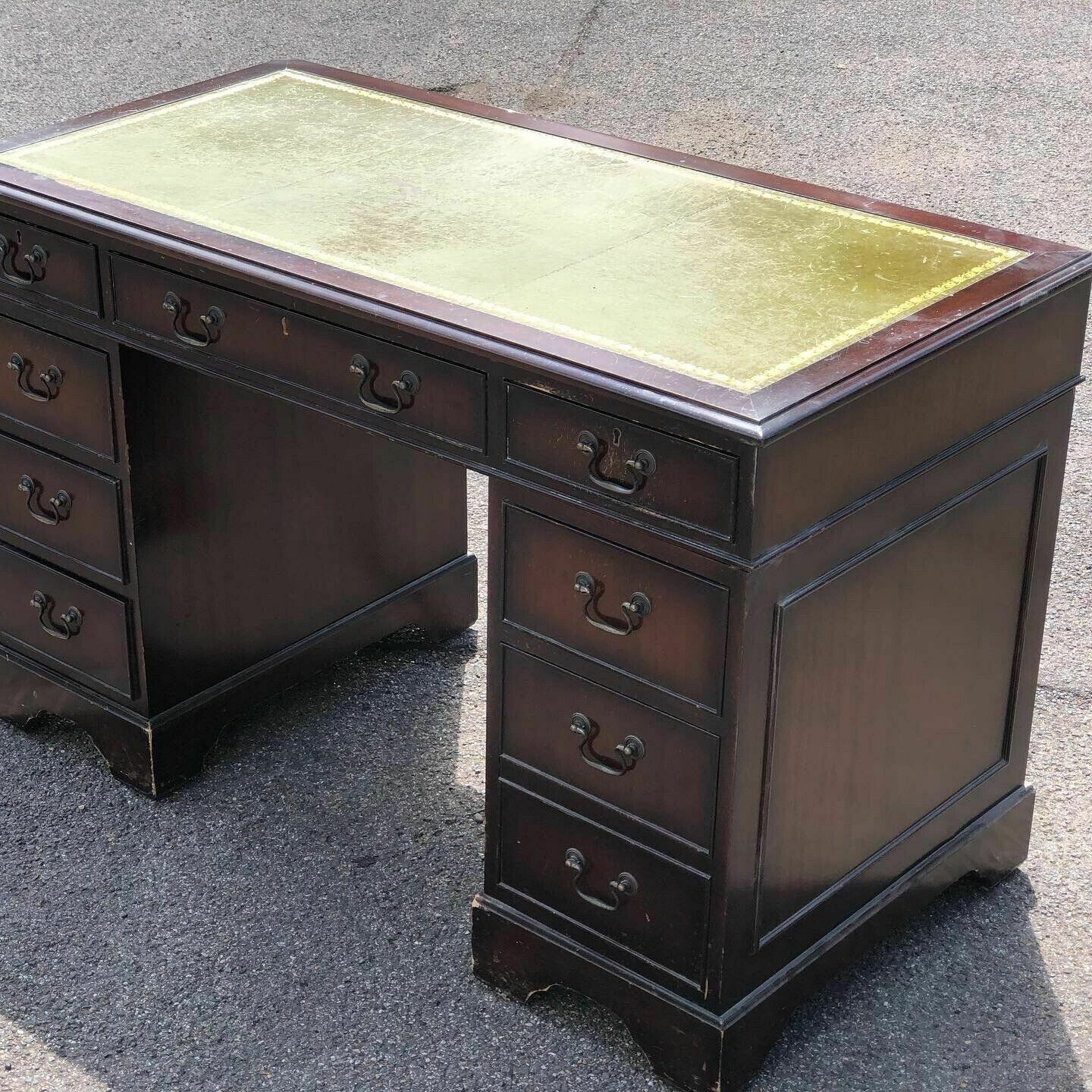 photo furniture Mahogany Pedestal Desk With Green Leather Top.