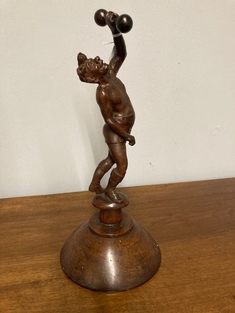 Ancient Sculpture In Walnut Depicting A Late 19th Century "Weightlifter", Italian School.