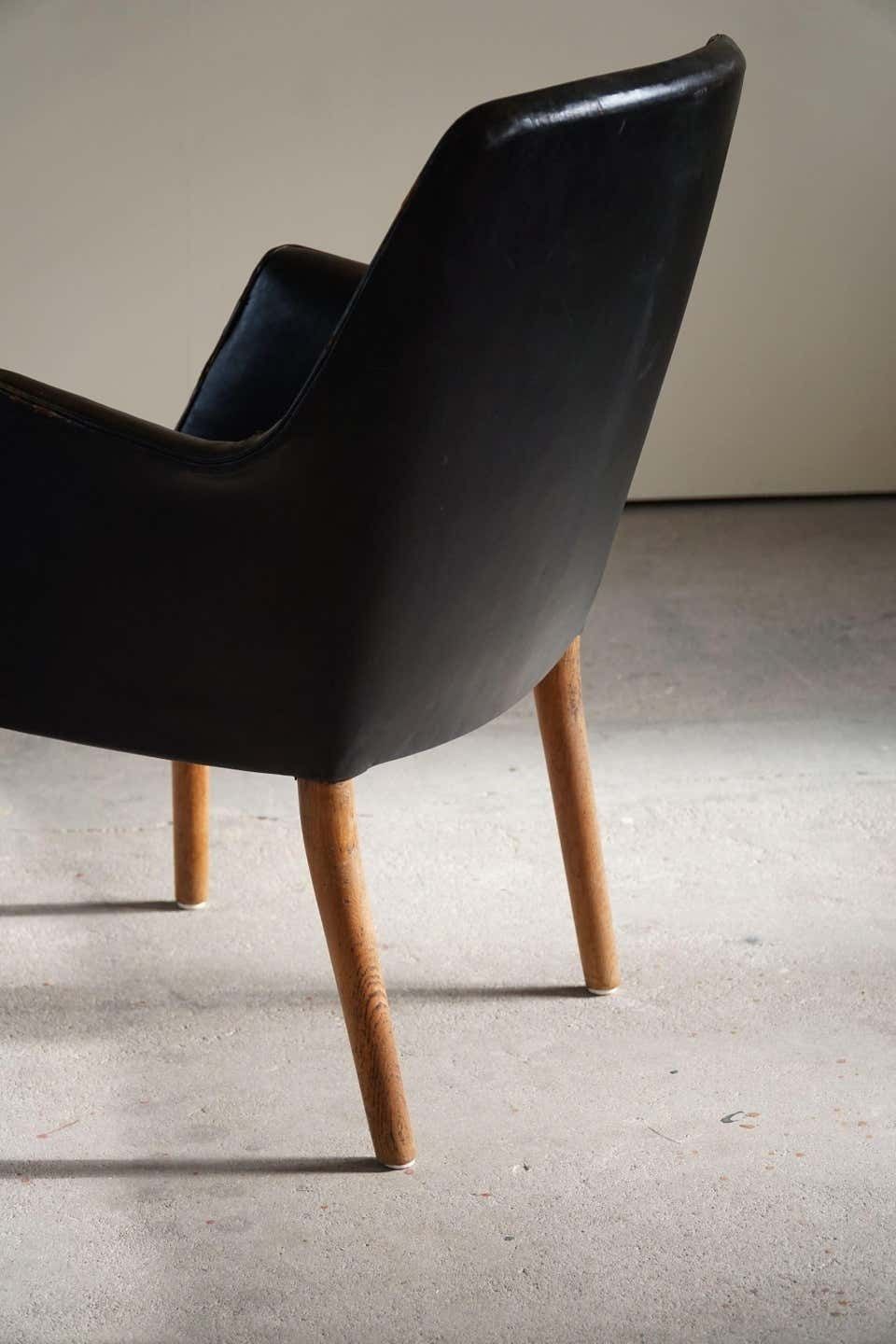 photo buy Danish Modern Armchair By Nanna Ditzel In Oak And Patinated Leather, 1950s